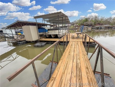 Lake of the Ozarks waterfront property featuring natural stone - photo 33
