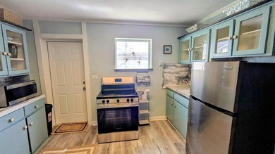Escape to this beautifully renovated coastal getaway, offered - photo 15