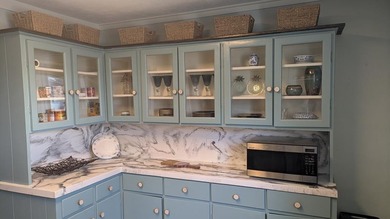Escape to this beautifully renovated coastal getaway, offered - photo 17