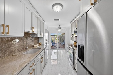 NOW OFFERED FURNISHED! Fully remodeled waterfront villa located - photo 10