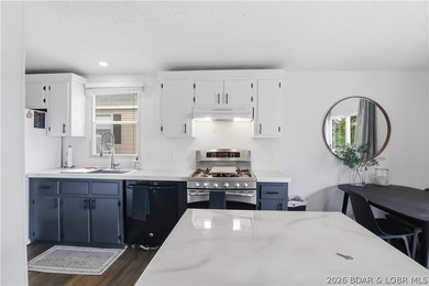 Wake up to beautiful lake sunrises at this turnkey retreat on - photo 14