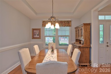 Peaceful Luxury awaits on a 1.4-acre lot in the gated community