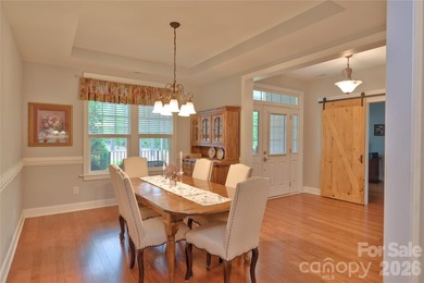 Peaceful Luxury awaits on a 1.4-acre lot in the gated community