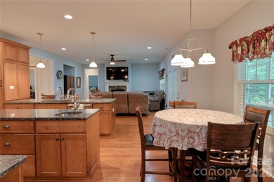 Peaceful Luxury awaits on a 1.4-acre lot in the gated community