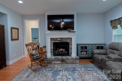 Peaceful Luxury awaits on a 1.4-acre lot in the gated community