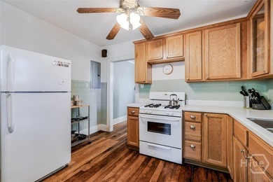 Built in 1923, this charming brick bungalow delivers the - photo 12