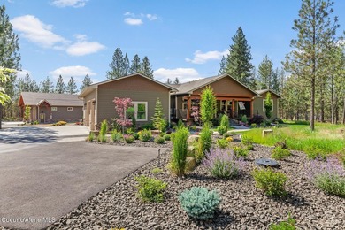 Set on a private, level 4.62-acre treed estate in desirable - photo 1