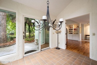 Tucked beneath a canopy of moss-draped oaks in the prestigious - photo 13