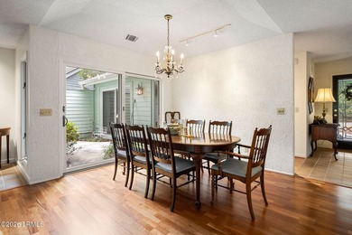 Tucked beneath a canopy of moss-draped oaks in the prestigious - photo 15