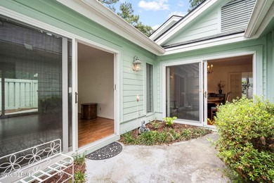 Tucked beneath a canopy of moss-draped oaks in the prestigious - photo 17