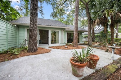 Tucked beneath a canopy of moss-draped oaks in the prestigious - photo 23