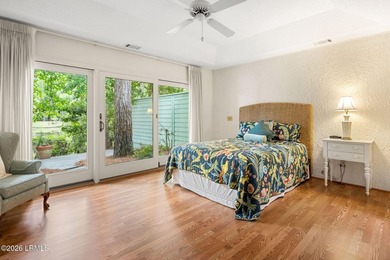 Tucked beneath a canopy of moss-draped oaks in the prestigious - photo 26