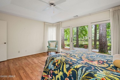 Tucked beneath a canopy of moss-draped oaks in the prestigious - photo 28