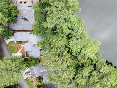 Tucked beneath a canopy of moss-draped oaks in the prestigious - photo 43