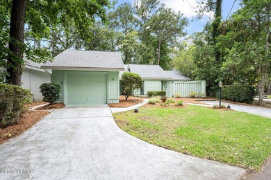 Tucked beneath a canopy of moss-draped oaks in the prestigious - photo 46