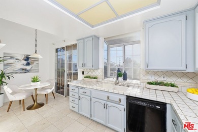 Welcome home to this rarely available top-floor condo offering