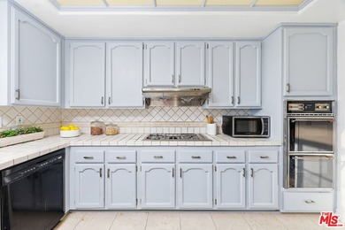 Welcome home to this rarely available top-floor condo offering