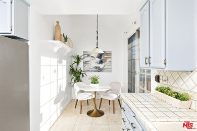 Welcome home to this rarely available top-floor condo offering