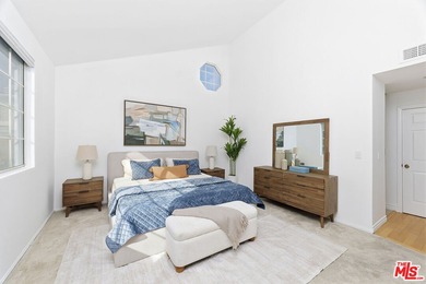 Welcome home to this rarely available top-floor condo offering