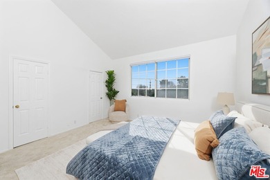 Welcome home to this rarely available top-floor condo offering