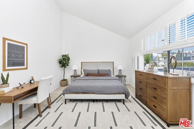 Welcome home to this rarely available top-floor condo offering