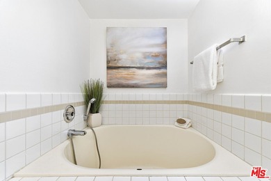 Welcome home to this rarely available top-floor condo offering