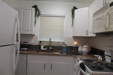 Welcome to this charming 2-bedroom, 2.5-bath condominium located - photo 8