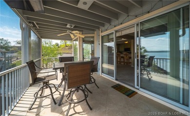 Enjoy stunning lake views from your screened-in deck overlooking - photo 15