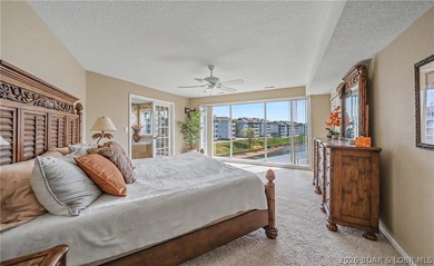 Enjoy stunning lake views from your screened-in deck overlooking - photo 16