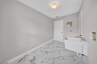 Fully remodeled waterfront home in Cape Coral featuring 3 - photo 11