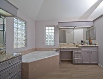Step into this versatile 3-bedroom, 2-bath home in the highly - photo 12