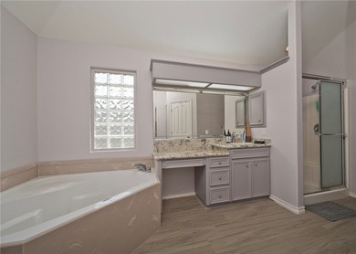 Step into this versatile 3-bedroom, 2-bath home in the highly - photo 13