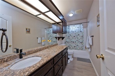 Step into this versatile 3-bedroom, 2-bath home in the highly - photo 16