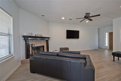 Step into this versatile 3-bedroom, 2-bath home in the highly - photo 17