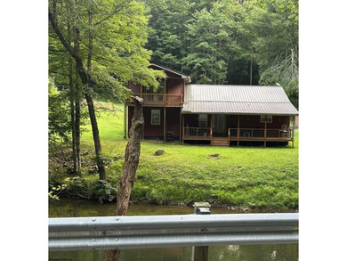 Riverfront retreat on 8 breathtaking acres! This beautiful home - photo 1