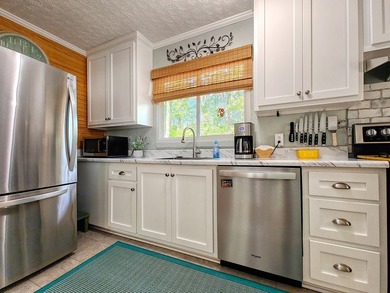 Set on a beautifully maintained 1.2 acre +/- lot, 195 Coast - photo 17