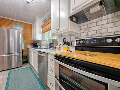 Set on a beautifully maintained 1.2 acre +/- lot, 195 Coast - photo 18