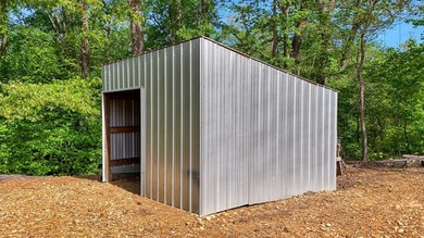 Set on a beautifully maintained 1.2 acre +/- lot, 195 Coast - photo 32