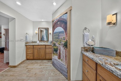Beautifully renovated 3-bedroom, 3-bath residence in the - photo 17