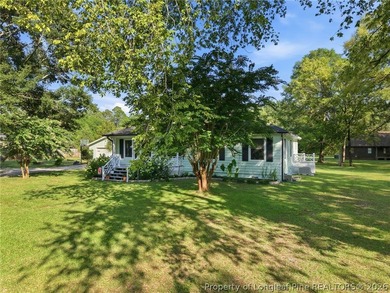 Tucked away on just under an acre in Hope Mills, this - photo 3