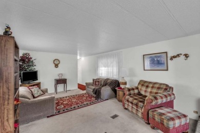 This spacious and exceptionally well-kept 2-bedroom, 1-bath home