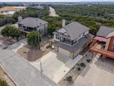 Experience elevated lake living at 185 Oyster Bay Drive, located