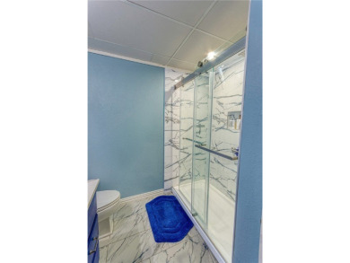 Very well-kept condo 2- bedroom 2 bath 2 cover parking garage on