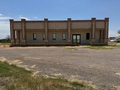 2.5 Acres Super Location Fronting Loop 250N! Improvements