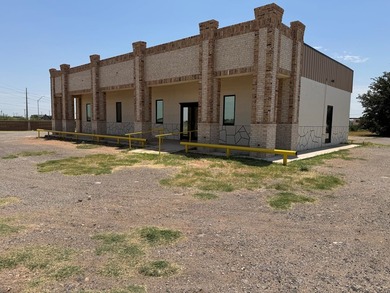 2.5 Acres Super Location Fronting Loop 250N! Improvements