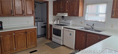 Large lakefront family home tucked back in a protective cove for - photo 11