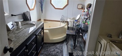 Large lakefront family home tucked back in a protective cove for - photo 18