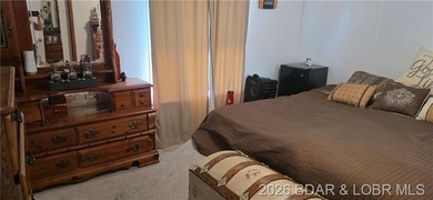 Large lakefront family home tucked back in a protective cove for - photo 31