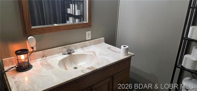 Large lakefront family home tucked back in a protective cove for - photo 34