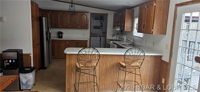 Large lakefront family home tucked back in a protective cove for - photo 37